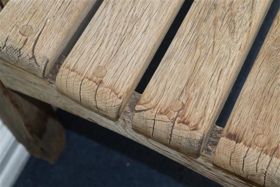 Gaze Burvill. An oak garden table, bench, low bench and pair of chairs Table L.170cm, Bench L.210cm, Low bench L.195cm